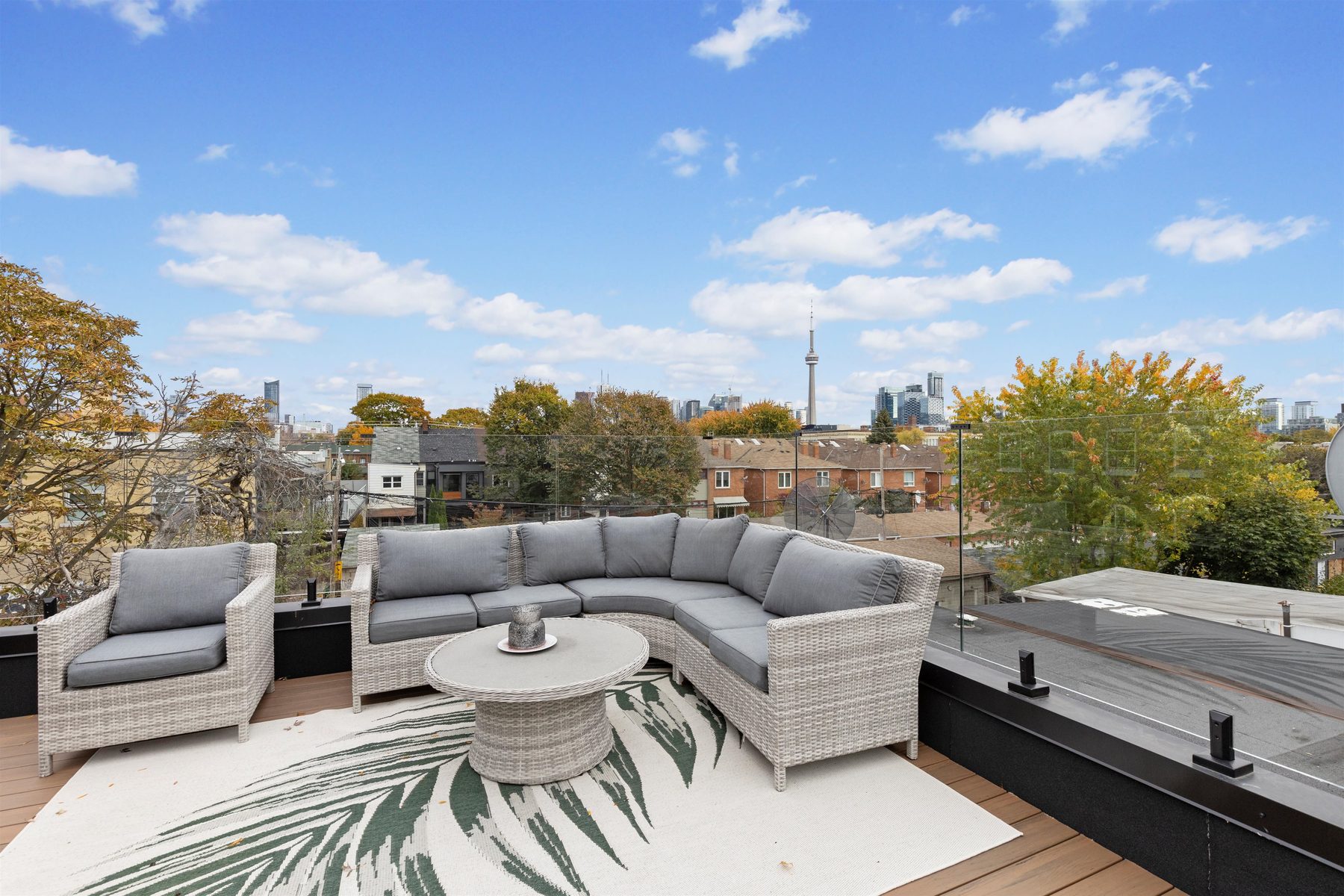 Trinity-Bellwoods — Legal rooftop patio — CN Tower view